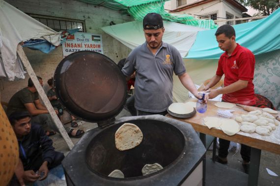 Palestinians ration limited supplies of bread to keep them going while they await essential humanitarian aid