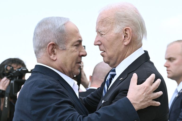 Israel Prime Minister Benjamin Netanyahu (L) greets US President Joe Biden upon his arrival at Tel Aviv's Ben Gurion airport