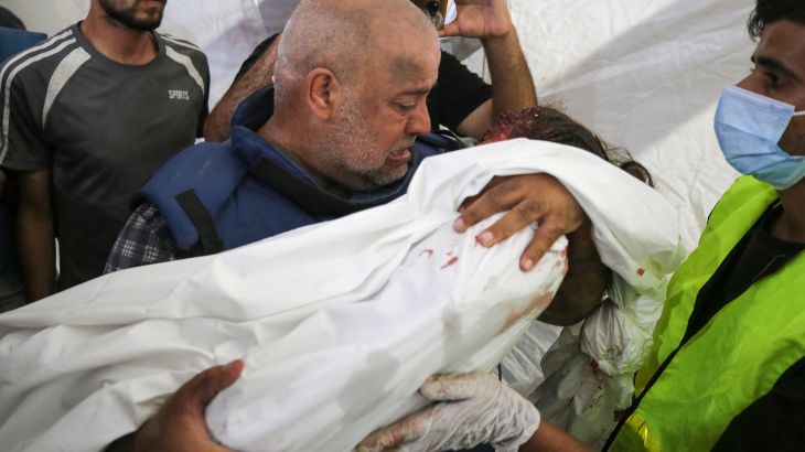 Al-Jazeera correspondent Wael Al-Dahdouh mourns over the body of one of his children