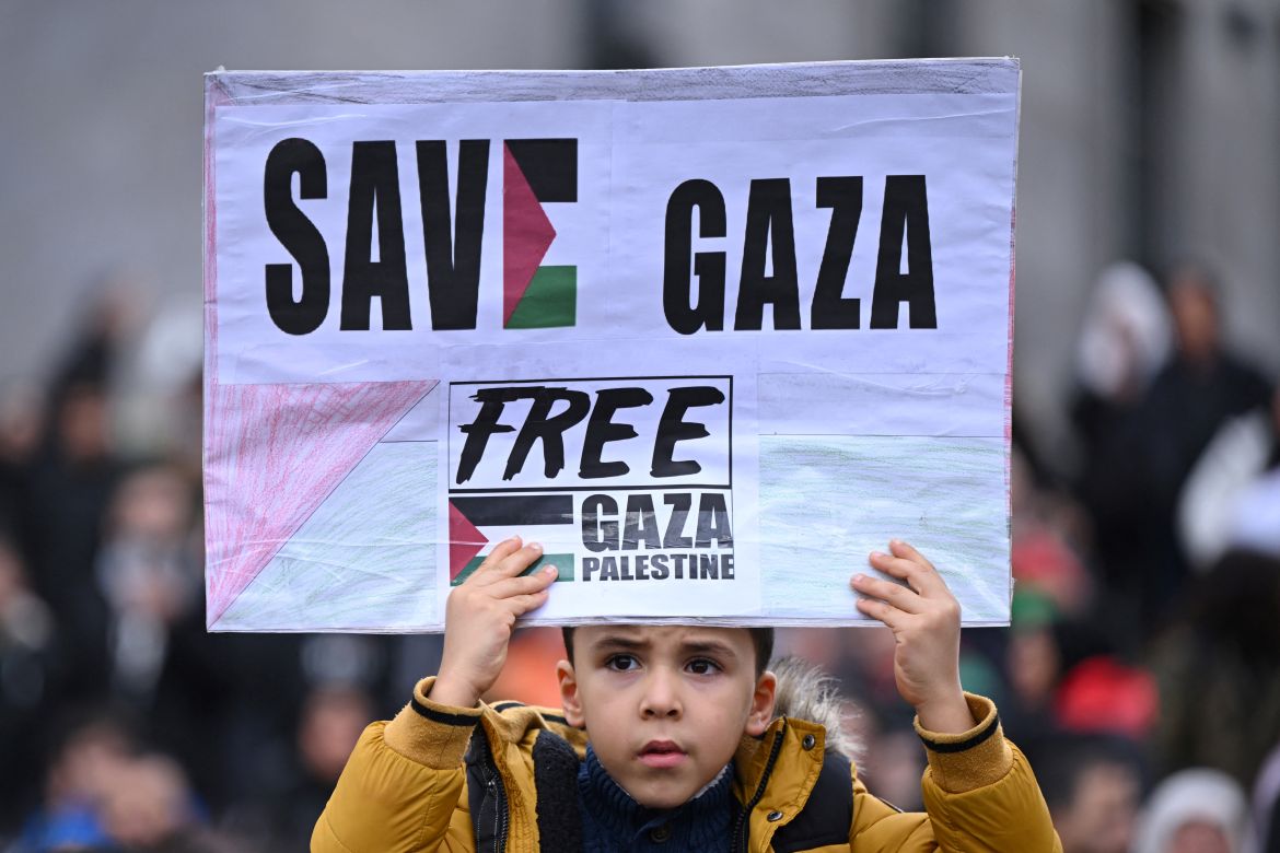 A protester holds a placard reading 'Save Gaza' during a 'March for Palestine' in Dortmund, western Germany