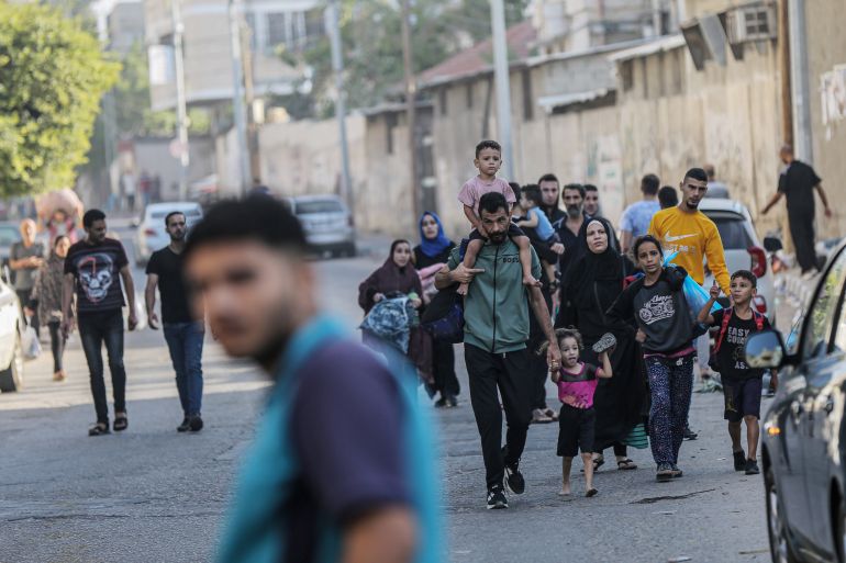 A Palestinian family leave their homes in the northern Gaza governates after an Israeli military order warned 1.1 million residents to make their way to southern Gaza Strip