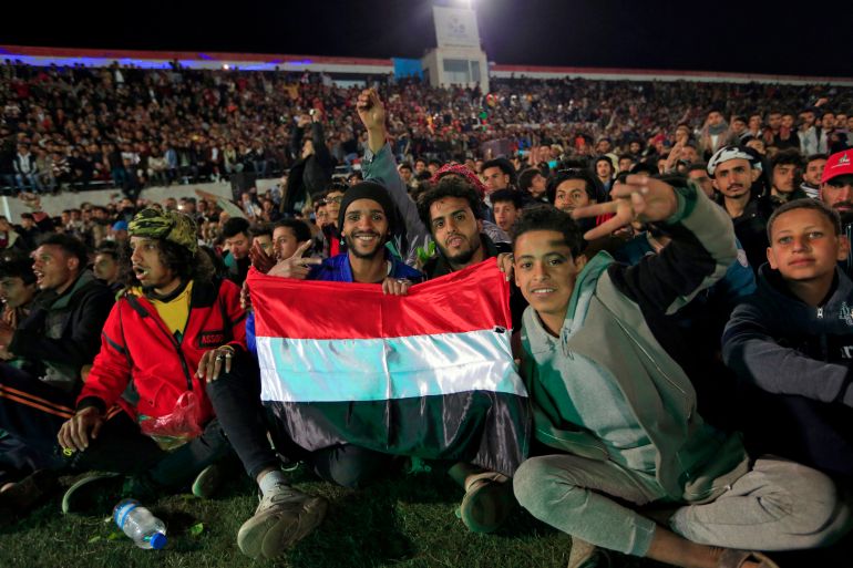 Yemeni fans gather at a stadium to watch on a screen the West Asian Junior Championships Cup football match between Yemen and Saudi Arabia,
