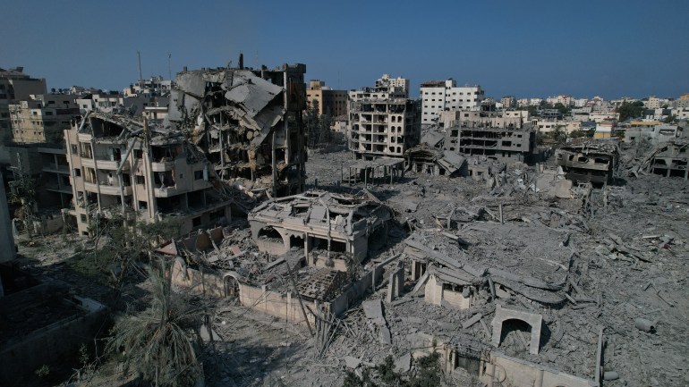 An aerial view of destroyed buildings following the Israeli airstrikes in Al-Rimal neighborhood of Gaza City, Gaza