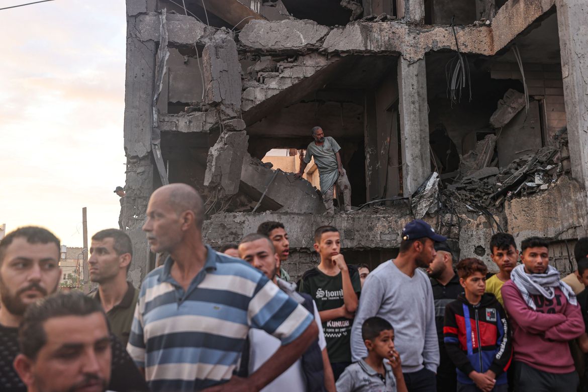 Civil defense members and residents conduct search and rescue operation amid rubble and destroyed buildings after Israeli attacks continue on the 11th day in Khan Yunis, Gaza on October 17, 2023