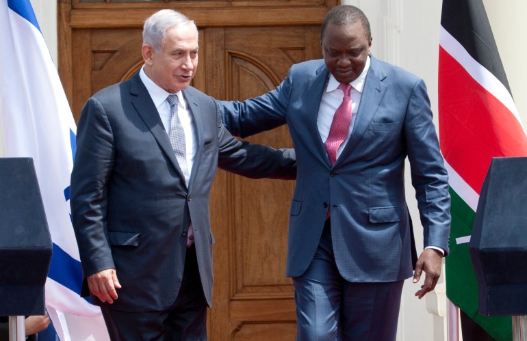 Israeli Prime Minister Benjamin Netanyahu, left, and Kenyan President, Uhuru Kenyatta, right, walk together after giving a joint press conference at State House in Nairobi, Kenya, Tuesday, July 5, 2016. Netanyahu is in Kenya as part of his four-nation tour of Africa. (AP Photo/Sayyid Abdul Azim)