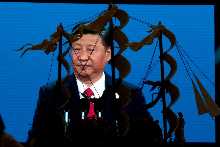 Xi Jinping shown against at model of Zheng He's ship