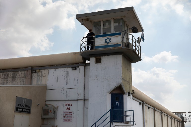 A prison guard stands at the Gilboa prison in northern Israel, Monday, Sept. 6, 2021. Israeli forces on Monday launched a massive manhunt in northern Israel and the occupied West Bank after several Palestinian prisoners escaped overnight from the high-security facility in an extremely rare breakout. (AP Photo/Sebastian Scheiner)