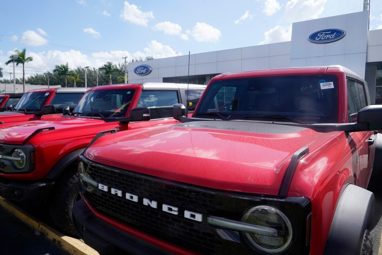 Ford Broncos line the the front of Gus Machado's Ford dealership, Monday, Jan. 23, 2023, in Hialeah, Fla. U.S.