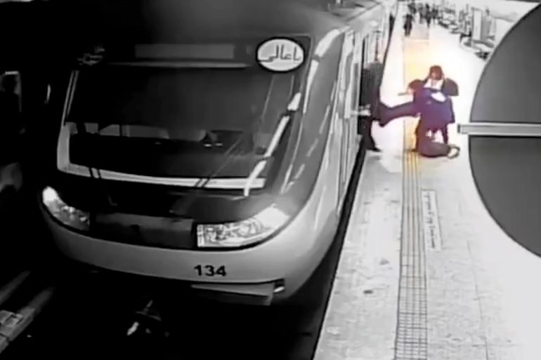 women pull 16-year-old Armita Geravand from a train car