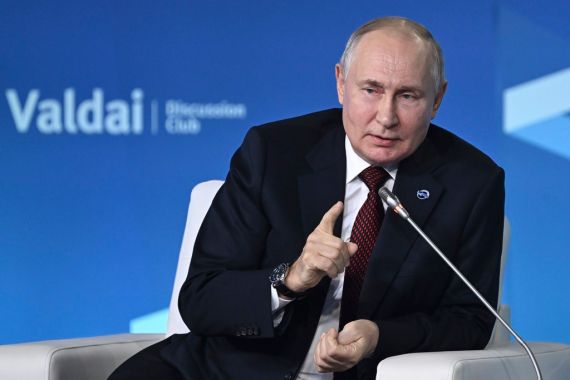 Russian President Vladimir Putin gestures while speaking at the annual meeting of the Valdai Discussion Club in the Black Sea resort of Sochi, Russia, Thursday, Oct. 5, 2023. (Grigory Sysoyev, Sputnik, Kremlin Pool Photo via AP)