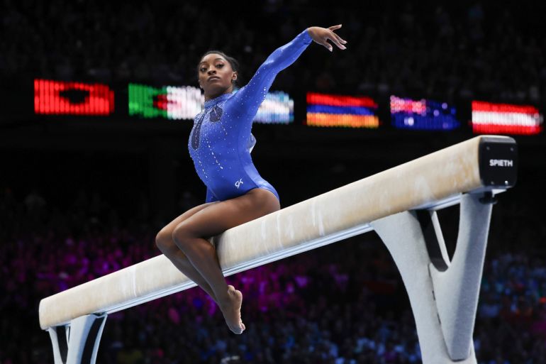 United States' Simone Biles competes on the beam during the women's all-round final at the Artistic Gymnastics World Championships in Antwerp, Belgium, Friday, Oct. 6, 2023. (AP Photo/Geert vanden Wijngaert)
