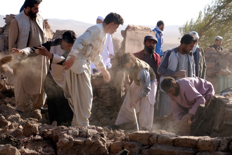 Afghans search for victims after an earthquake in Zenda Jan district in western Afghanistan's Herat province.