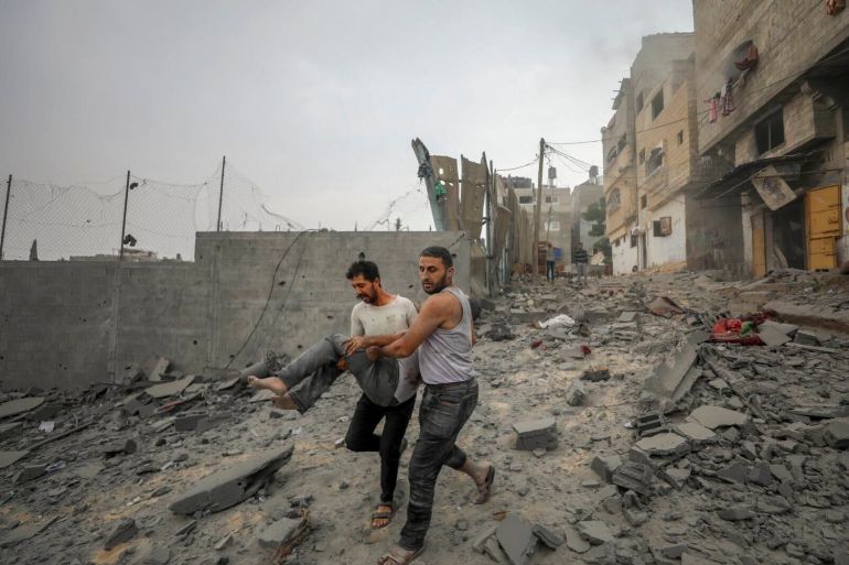Palestinians evacuate wounded in Israeli aerial bombing on Jabaliya in Gaza.