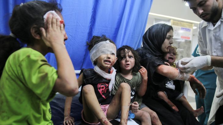 Palestinian children wounded in Israeli strikes are brought to Shifa Hospital in Gaza City