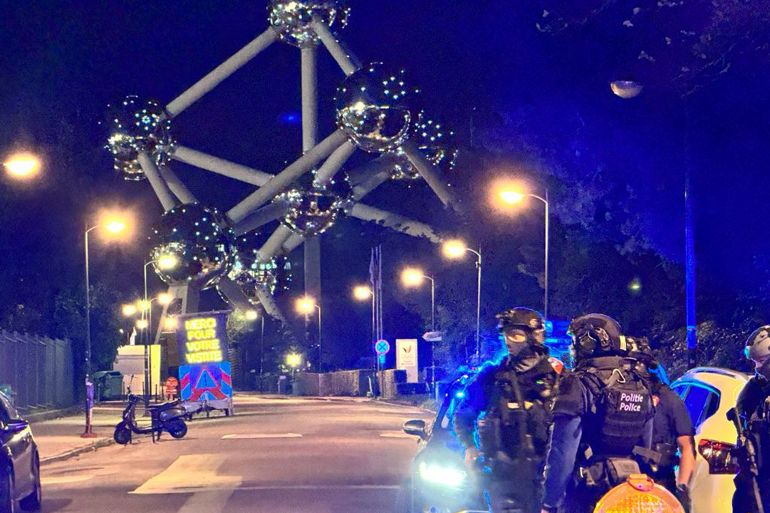 Police patrol in the Belgian capital outside the national stadium after a shooting on Monday night