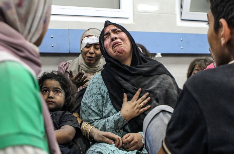 Wounded Palestinians at the al-Shifa hospital, following Israeli airstrikes, in Gaza City, central Gaza Strip