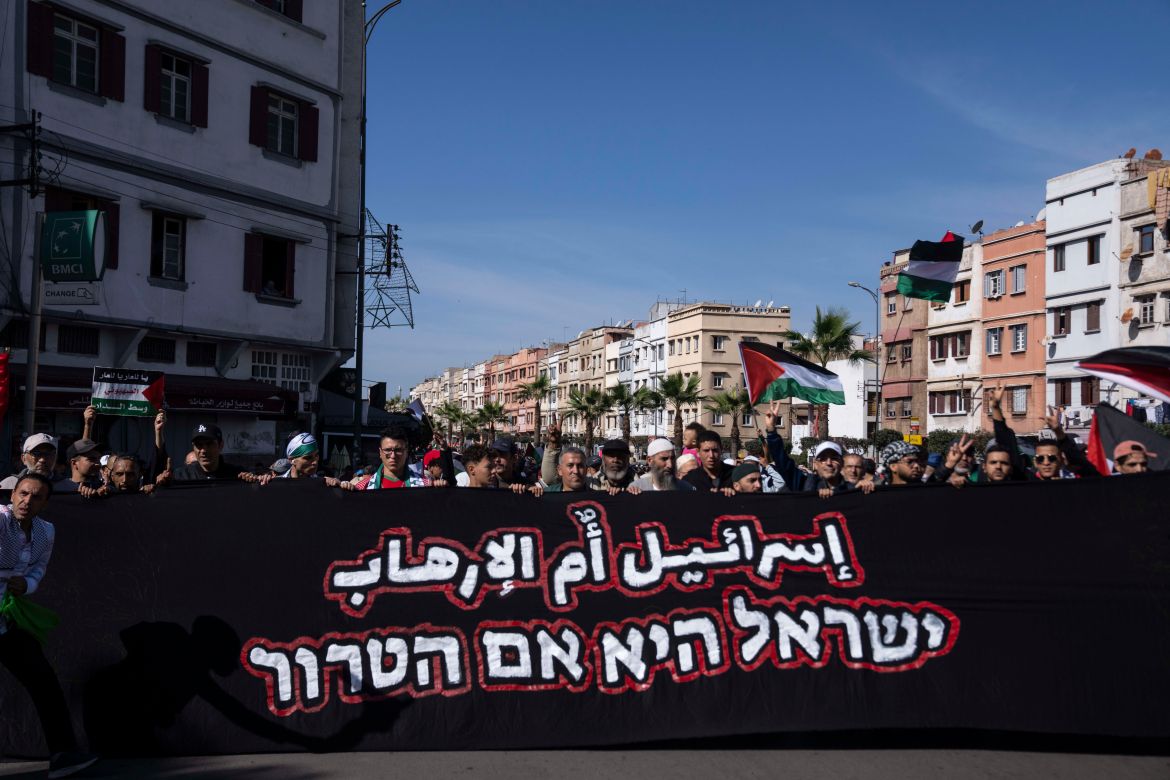 Thousands Moroccans take part in a protest in solidarity with Palestinians in Gaza and against normalisation with Israel, in Casablanca, Morocco, Sunday, Oct. 29, 2023. Banner in Arabic reads "Israel is the mother of terrorism"