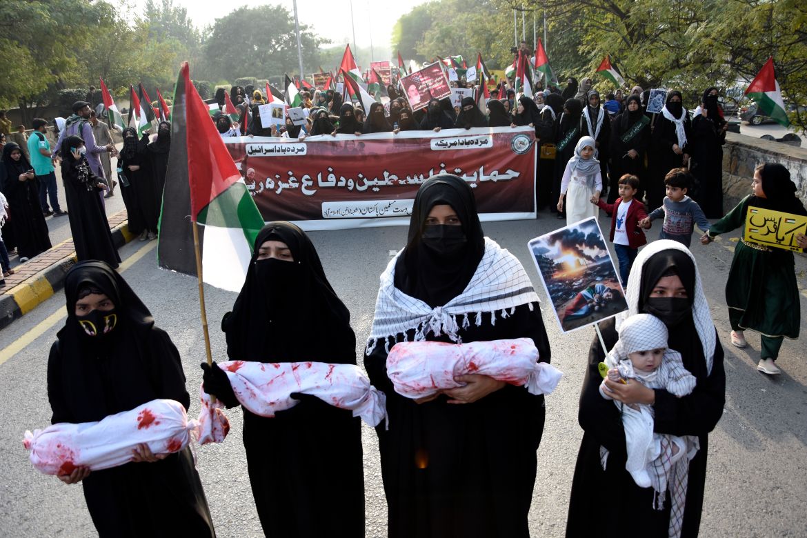 Supporters of a religious party Majlis Wahdat-e-Muslimeen Pakistan carry mock coffins during a protest against Israeli airstrikes on Gaza, to show solidarity with Palestinian people, in Islamabad, Pakistan