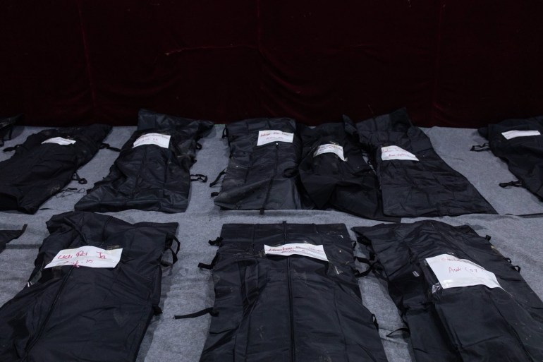Rows of black body bags following the attack