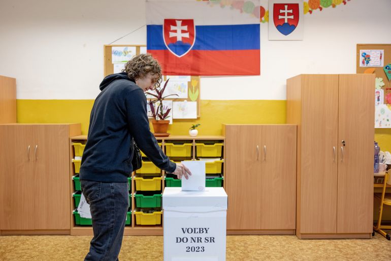 A voter casts his ballots at a polling station in Slovak parliamentary elections in Bratislava, Slovakia