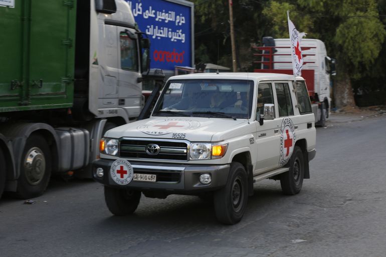 International Committee of the Red Cross (ICRC) vehicles transport Palestinians whose homes were destroyed in the attacks to safe areas