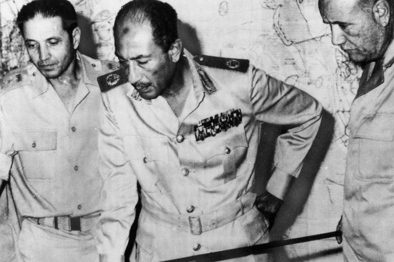 Egypt's chief of staff, Saad el-Shazly (left), President Anwar Sadat (centre) and minister of war' Ismail Ali (right) review battlefield developments