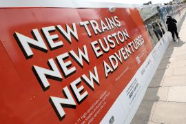 A sign promoting the HS2 high-speed rail line at a construction site at Euston in London [File: Toby Melville/Reuters]