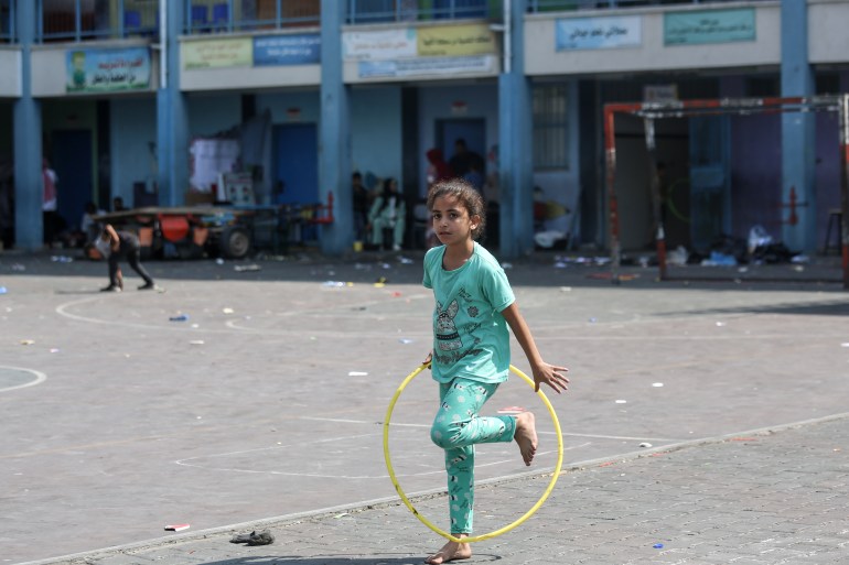 Palestinian girl playing in playground of an UNRWA school