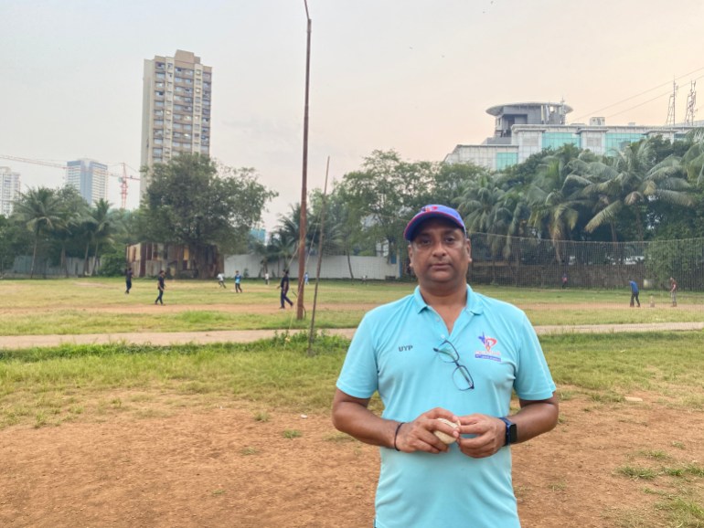 Mahesh Balakrishnan holds a white cricket ball in his right hand