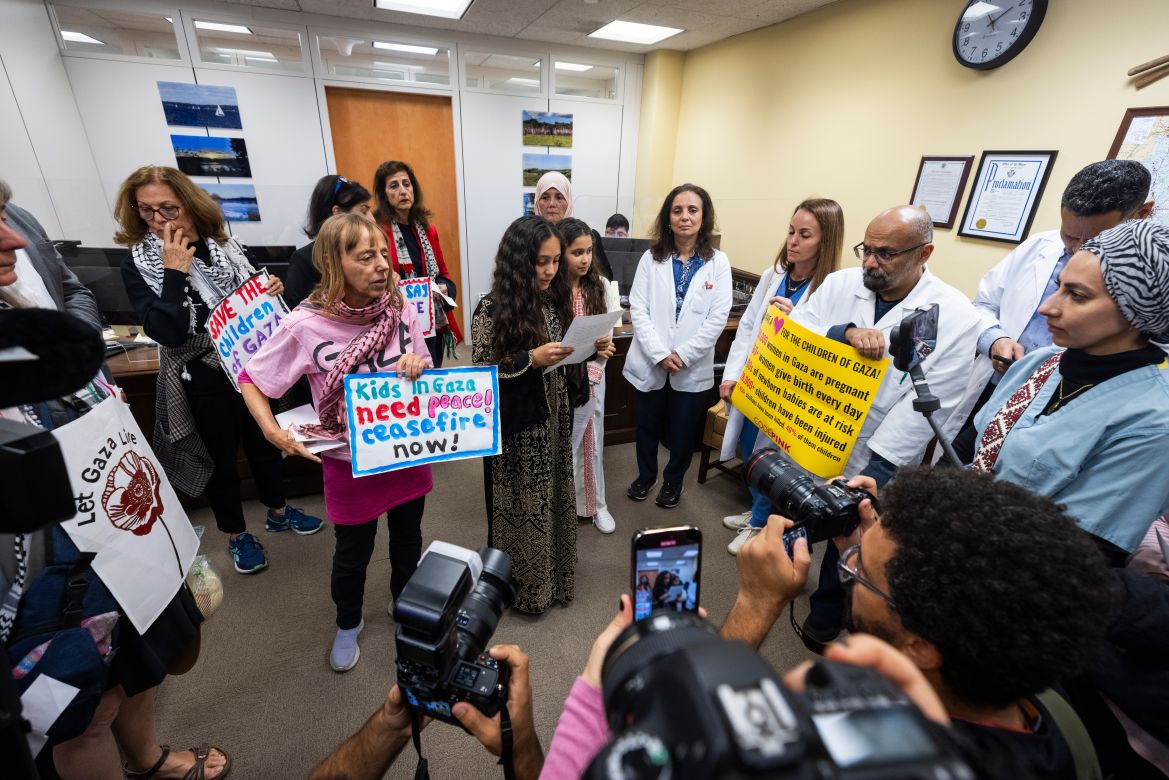 Activists from the American Palestinian Women's Association and CODEPINK gather in Democratic Senator from Wisconsin Tammy Baldwin's office to urge female Senators to call for an Israeli ceasefire in Gaza in the Hart Senate Office Building in Washington.
