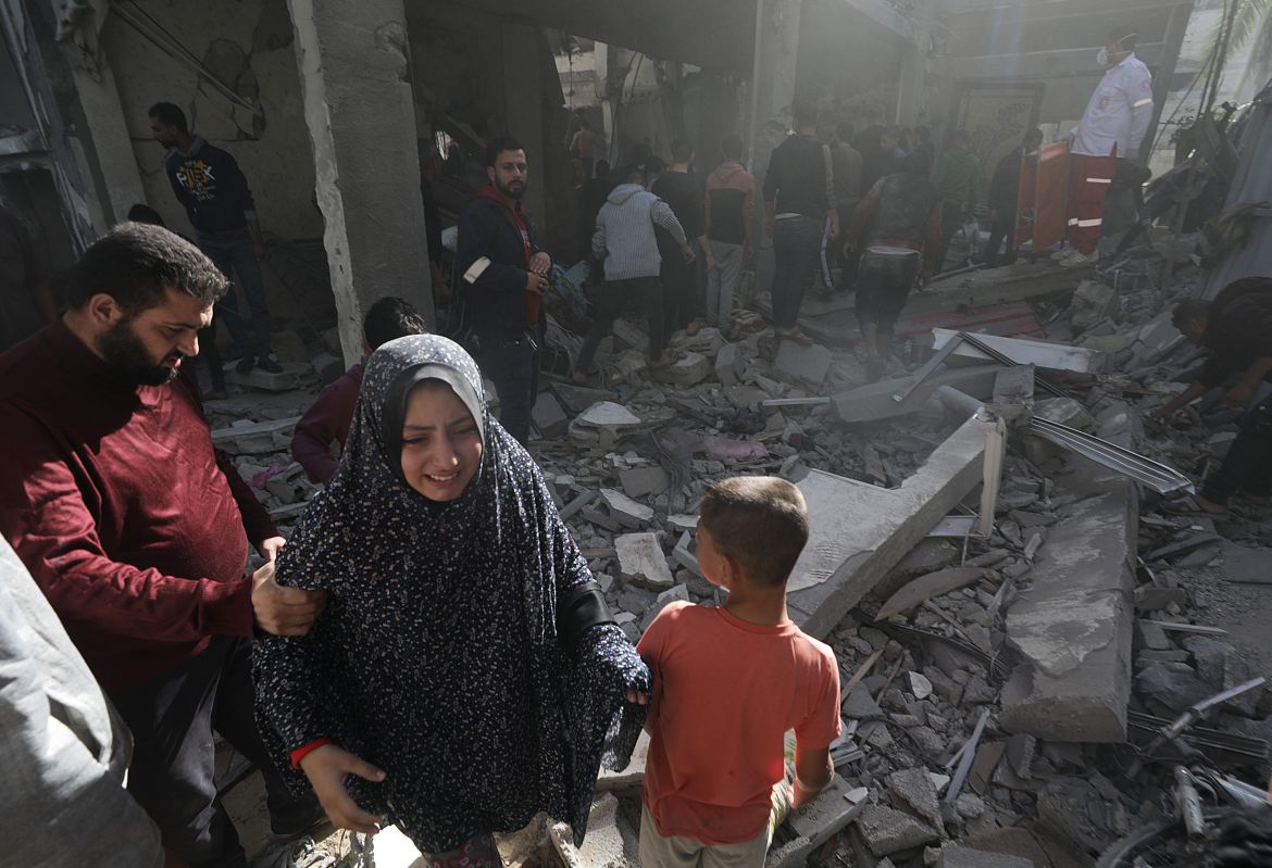 Palestinians search for bodies and survivors among the rubble of a destroyed house following fresh Israeli airstrikes in Khan Younis, southern Gaza Strip.