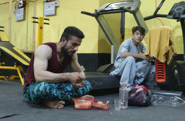Asad having dinner after a workout at the gym