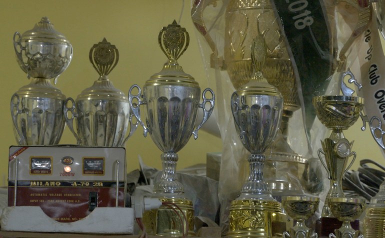 Trophies won by Zahir and his students on display at the gym