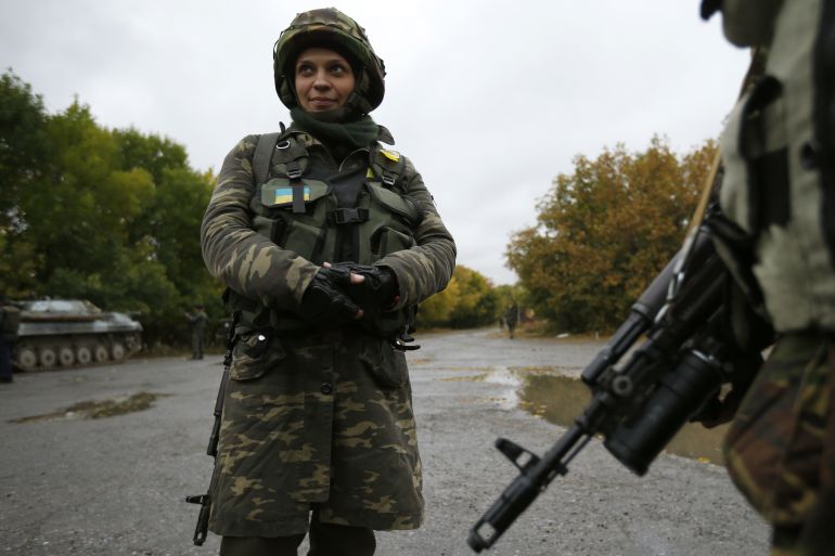 Ukrainian servicewoman Nadie, 36, stands at the military camp in the village of Luhanske, eastern Ukraine September 24, 2014