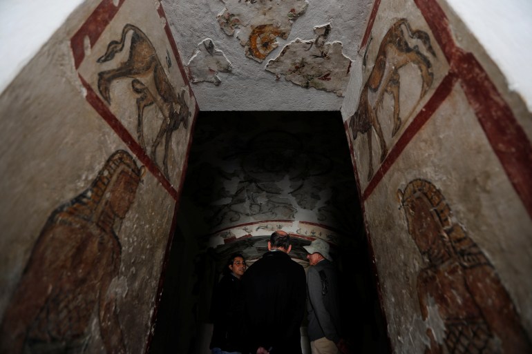Archaeologists talk during a tour by officials of the Ministry of Antiquities of the Kom El-Shoukafa catacombs in Alexandria, Egypt March 3, 2019.