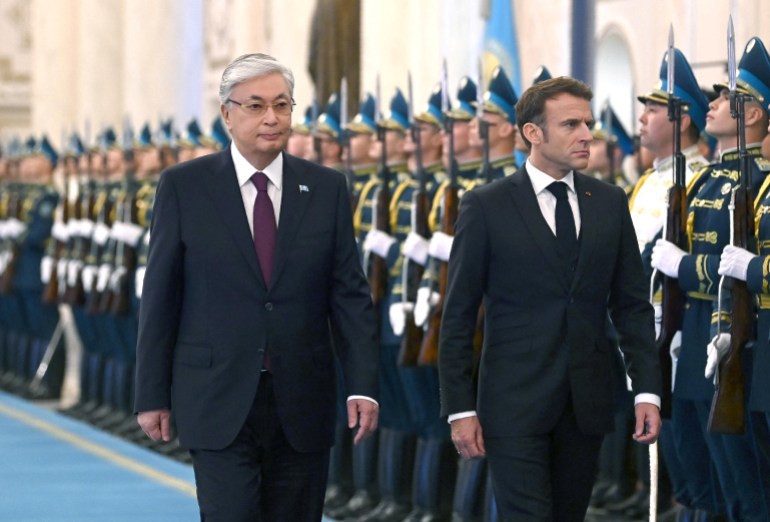 Kazakh President Kassym-Jomart Tokayev and French President Emmanuel Macron take part in a welcome ceremony before their talks in Astana, Kazakhstan November 1, 2023. Press service of the President of Kazakhstan/Handout via REUTERS ATTENTION EDITORS - THIS IMAGE HAS BEEN SUPPLIED BY A THIRD PARTY. MANDATORY CREDIT.
