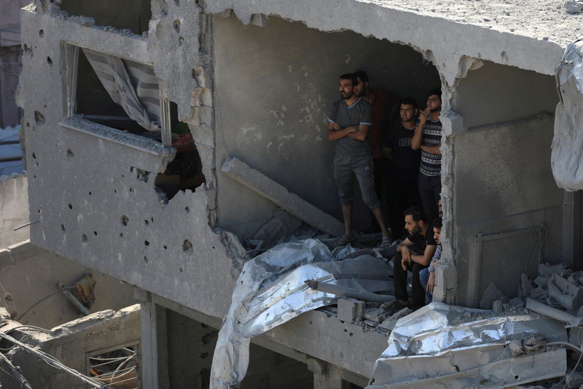 Palestinians observe as others search for casualties a day after Israeli strikes on houses in Jabalia refugee camp in the northern Gaza Strip.