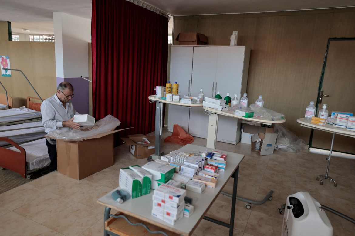Doctor Georges Madi, inspects a box of medical supplies at the field hospital, set up by locals near the Lebanese-Israeli border to give first aid treatment to those potentially injured amidst tension between Israel and Hezbollah at the Christian village of Rmeish, Lebanon.