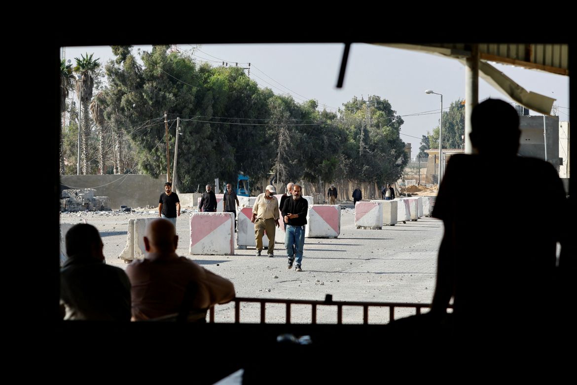 Palestinian labourers, who were in Israel during the Hamas October 7 attack, arrive at the Rafah border after being sent back by Israel to the strip, in the southern Gaza Strip.