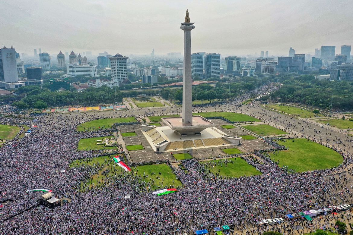 People gather at the National Monument (Monas) complex to attend a rally supporting Palestinians in Gaza