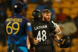 New Zealand's Tom Latham and Glenn Phillips celebrate after the match