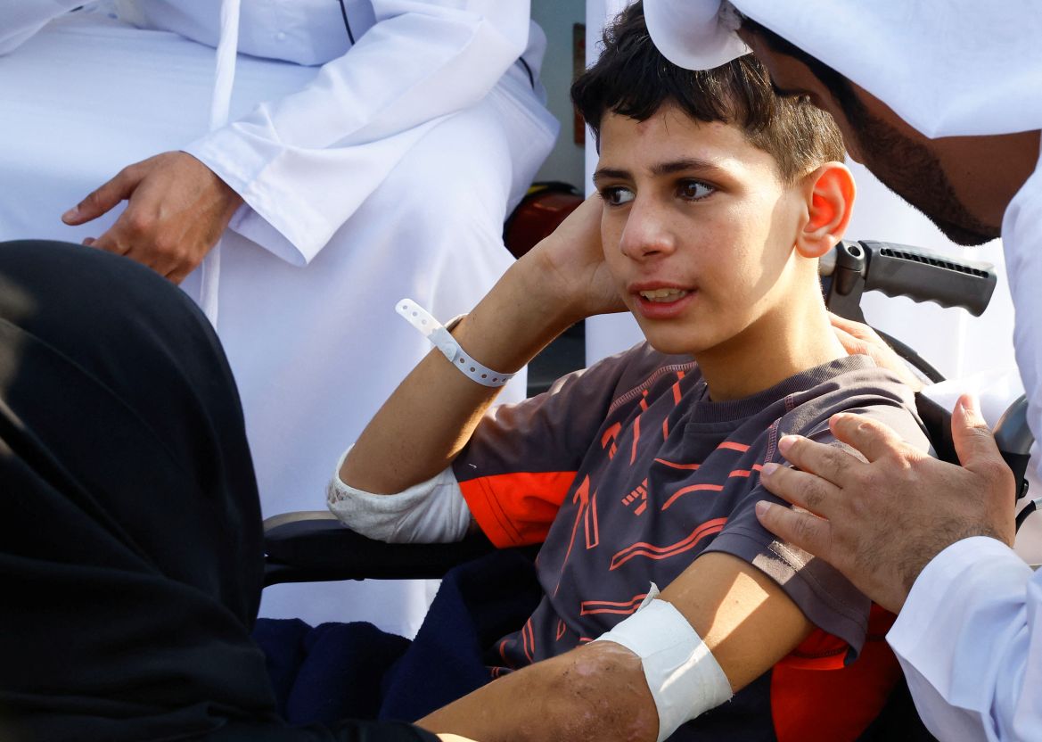 An injured child arrives as Palestinian children and families who were evacuated from Gaza amid the ongoing conflict between Israel and Palestinian Islamist group Hamas, arrive to receive treatment in Abu Dhabi, United Arab Emirates