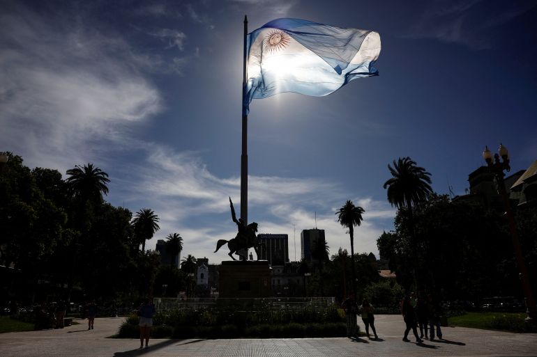 An Argentinian flag waves outside the Casa Rosada Presidential Palace