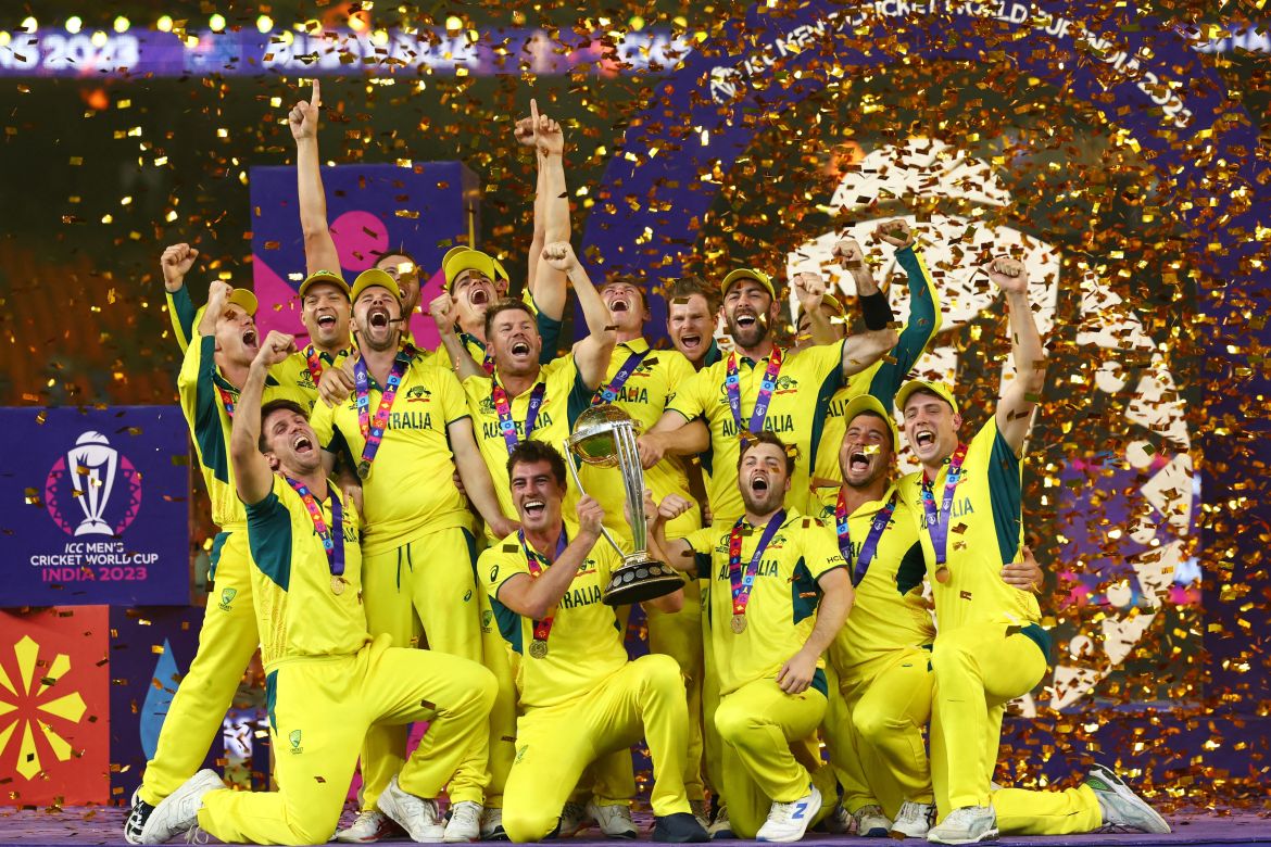 Australia players celebrate with the trophy