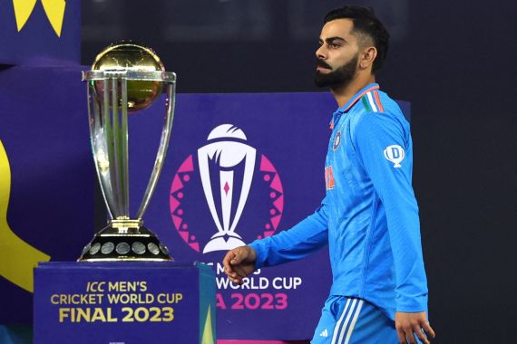 Cricket - ICC Cricket World Cup 2023 - Final - India v Australia - Narendra Modi Stadium, Ahmedabad, India - November 19, 2023 India's Virat Kohli looks dejected as he walks past the ICC Cricket World Cup trophy during the medal ceremony REUTERS/Andrew Boyers TPX IMAGES OF THE DAY