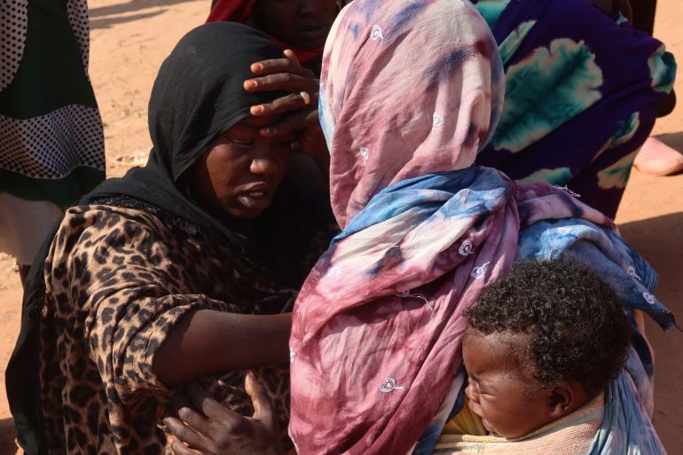 Women from el-Geneina, West Darfur, await news of their missing relatives as they gather near the border crossing in Adre, Chad, November 7, 2023