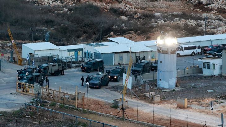 Army members standby near the Israeli military prison, Ofer, near Ramallah, in the Israeli-occupied West Bank, where some Palestinian prisoners are expected to be released as part of the Israel-Hamas deal to free hostages held in Gaza in exchange for the release of Palestinian prisoners