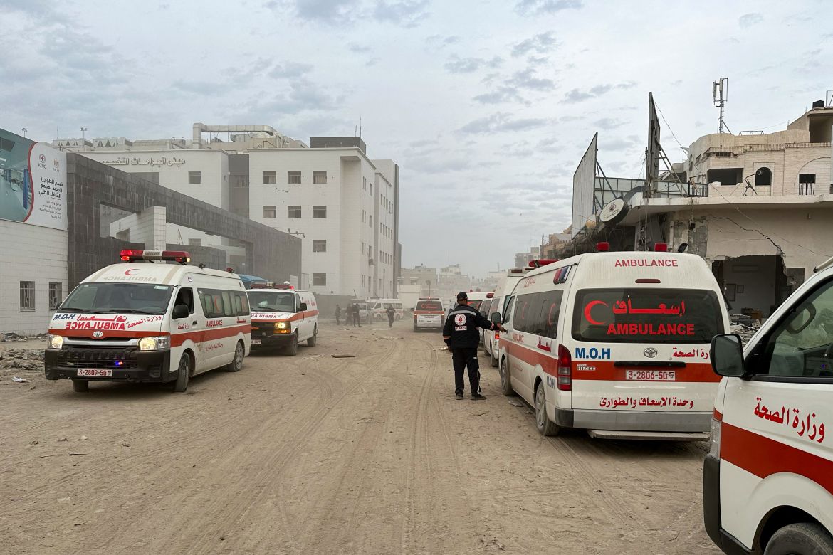 Ambulances wait outside Al Shifa hospital, which was raided by Israeli forces during Israel's ground operation, amid a temporary truce between Israel and the Palestinian group Hamas in Gaza City, November 25