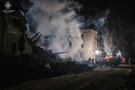 Rescuers work at a site of a residential building damaged by a Russian missile attack in Novogrodivka, Donetsk, on November 30 [Press service of the State Emergency Service of Ukraine in Donetsk region/Handout via Reuters]