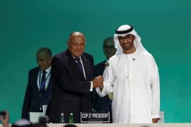 UAE Minister of Industry and Advanced Technology and COP28 President Sultan Ahmed al-Jaber, right, and Egyptian Foreign Minister and COP27 President Sameh Shoukry, left, at the COP28 opening in Dubai, UAE, November 30 [Amr Alfiky/Reuters]